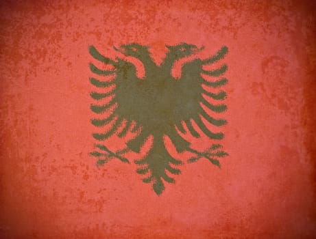 old grunge paper with Albania flag background