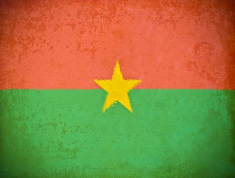 old grunge paper with Burkina Faso flag background