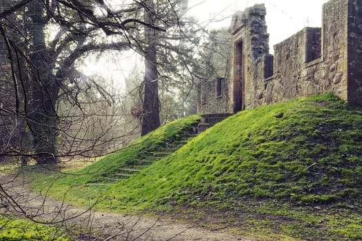 Ruins of "Cammo House", part of "Cammo Estate", Edinburgh, Scotland. Ancient temple on the terrain elevation surrounded by the forest.