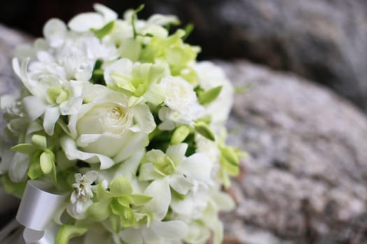 Beautiful wedding bouquet of white orchids and roses.