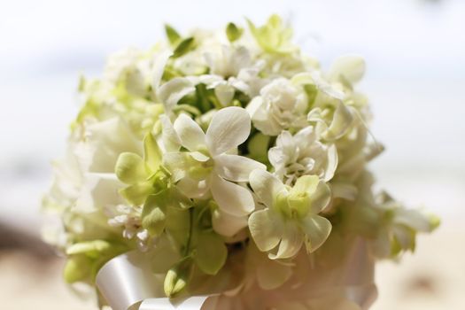 Beautiful wedding bouquet of white orchids and roses.