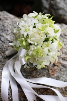 Beautiful wedding bouquet of white orchids and roses.