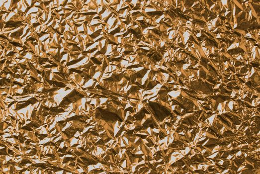 Abstract corrugated golden background sheet.