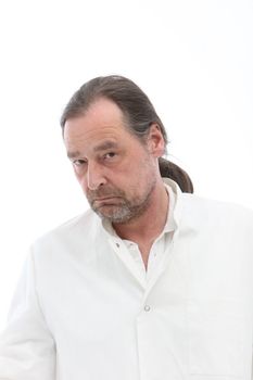 Portrait of mature man with long hair on white background