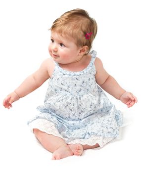 Happy baby sitting on white towel