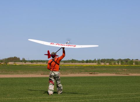 Man launches into the blue sky RC glider