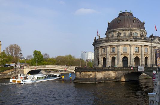 Boat passing the Bode Museum on the Spree, in Berlin.