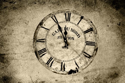 An old station clock in sepia grunge.