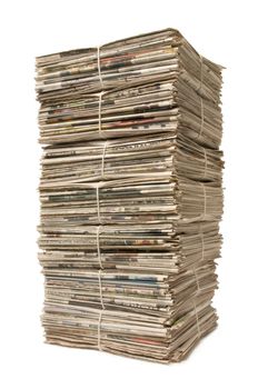 Towering stack of bound newspapers for recycling