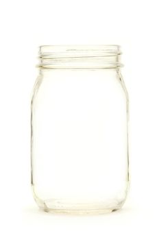 Empty glass jar isolated on white