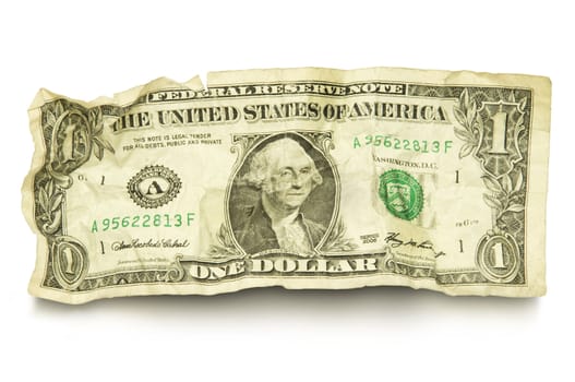 Single crumpled dollar bill against white background