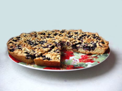 Fresh and tasty pie with bilberry isolated on the white background