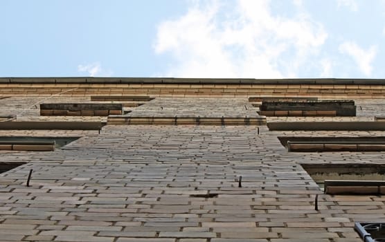 An up-view on the old brick building
