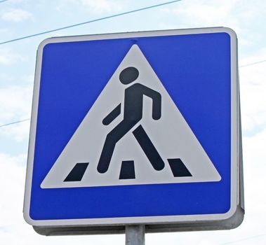 A pedestrian crossing sign in the street