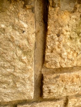 fake yellow stone on a building as background