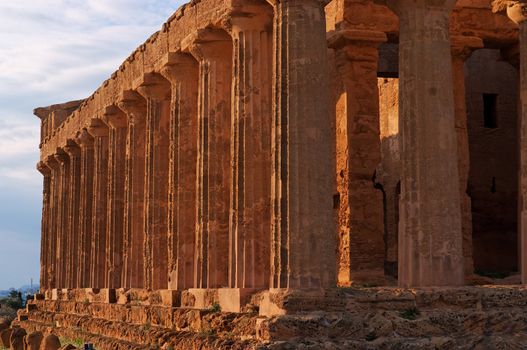 Colonnade of ancient Concordia temple in Agrigento, Sicily, Italy at sunset
