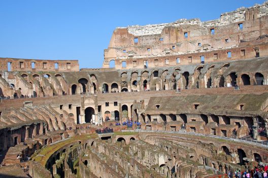 ROME, ITALY - MARCH 07: Tourists inside Colosseum ruin on March 07, 2011 in Rome, Italy