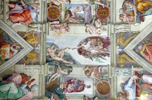 ROME, ITALY - MARCH 08: Michelangelo's masterpiece: Sistine Chapel ceiling with Creation of Adam in center on March 08, 2011 in Rome, Italy