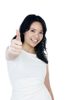 Portrait of an attractive young Asian woman giving thumb up gesture against white background.
