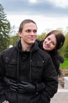 Portrait of happy couple in park.