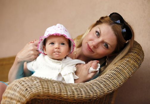 Portrait of beautiful happy smiling mather with baby outdoor