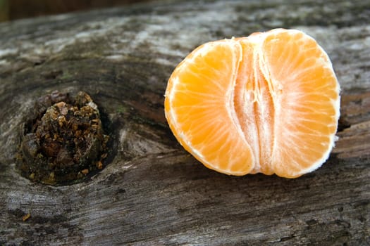 A mandarin on old wood