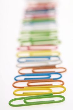 colorful paperclips on white