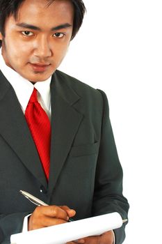 Businessman In Suit And Tie Writing A Note Or Memo