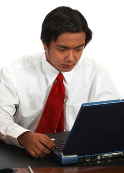 Office Worker Using Internet On His Laptop