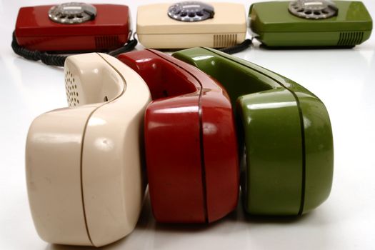 colourful retro phones symbolizing conference/teamwork/network............