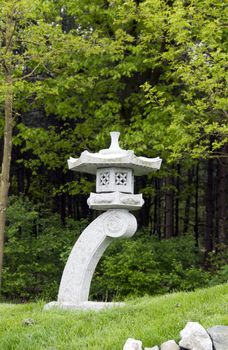 Green grass and japanese garden ornament
