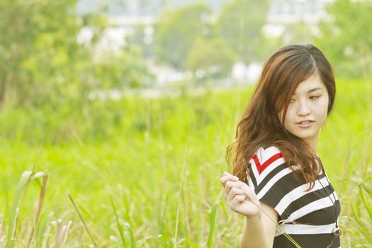 Beautiful girl in summer relaxing and thinking.