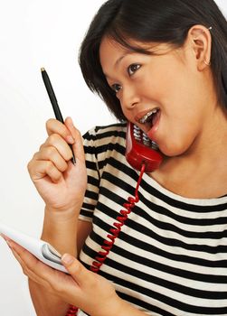 Happy Secretary Talking To Someone And Taking Notes