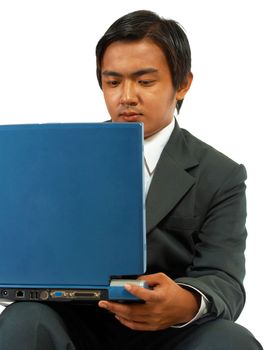 Businessman With A Problem Concentrating On Work On His Laptop