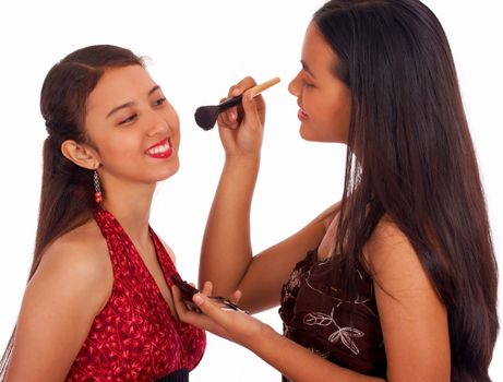 Girl Adding Blusher To Give Her Friend A Make Over