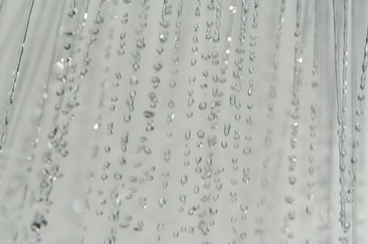 water drops falling from a shower indoors