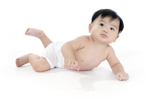 Portrait of an adorable infant baby crawling on white background.