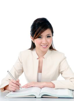 Portrait of a beautiful young businesswoman smiling over white background.