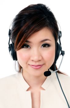 Portrait of a cute Asian businesswoman wearing headset against white background.