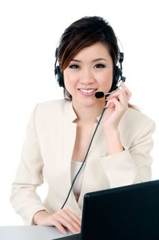 Portrait of a happy Asian businesswoman wearing headset against white background.