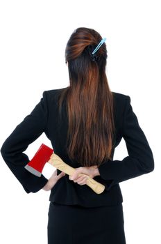 Businesswoman holding an axe behind her back, isolated on white.