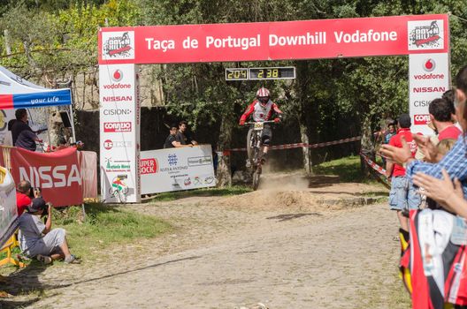 VIANA DO CASTELO, PORTUGAL - MAY 13: Joao Gois crossing the finish line on the 4th Stage of the Taca de Portugal Downhill Vodafone on may 13, 2012 in Viana do Castelo, Portugal.