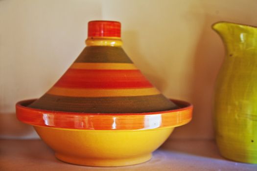 Still life display of a middle east baking oven, tagine and a pitcher