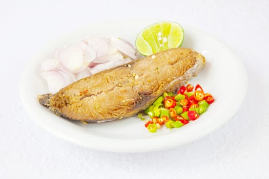 fish food on plate isolated on white background