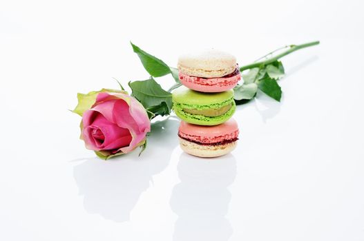 beautiful rose and assortment of macarons