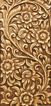 Pattern of flower carved on wood background