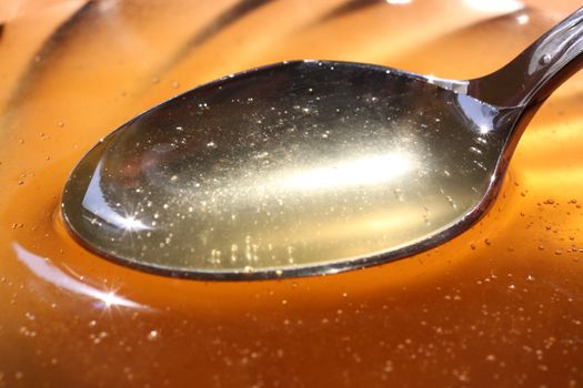 close up of teaspoon of honey