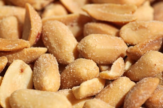 close up of heap of salted peanuts