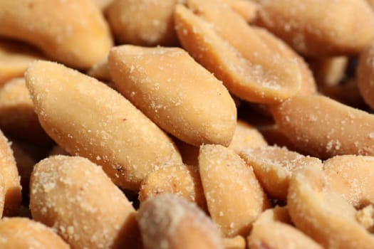 close up of heap of salted peanuts