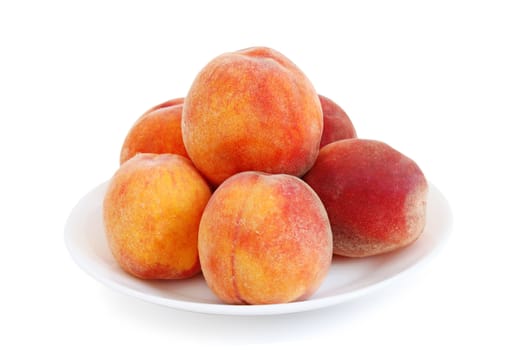 several peaches on a plate